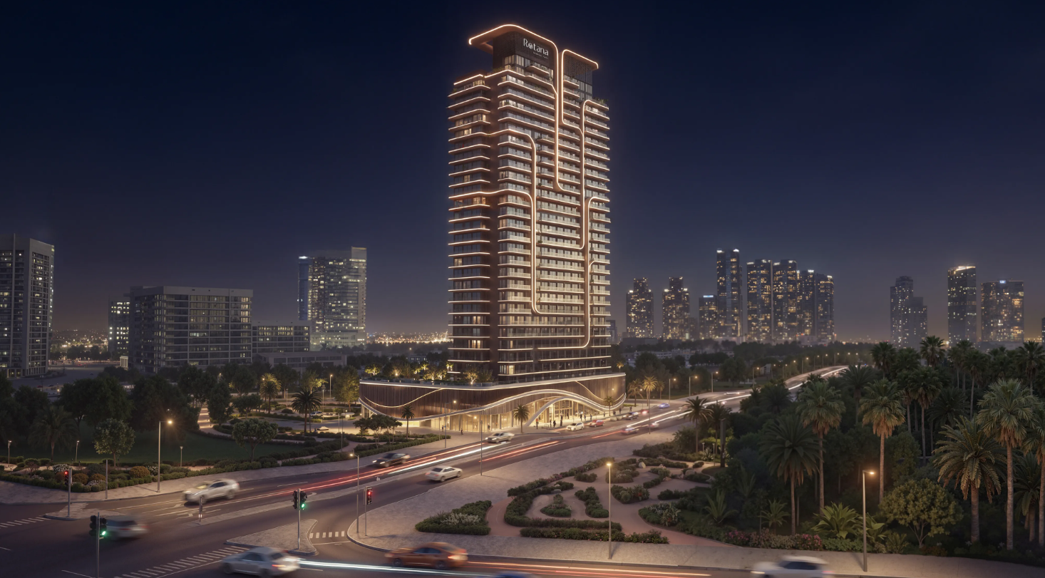 Illuminated modern facade of Rotana Residences tower on Al Reem Island Abu Dhabi showcasing luxury real estate architecture.