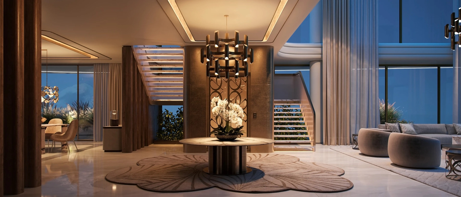 Premium apartment living room at Elie Saab Waterfront Abu Dhabi seamlessly connecting to a private panoramic glass balcony.