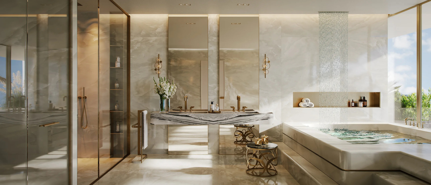 Opulent marble en-suite bathroom at Elie Saab Waterfront Abu Dhabi featuring standalone soaking tub and dual vanities.