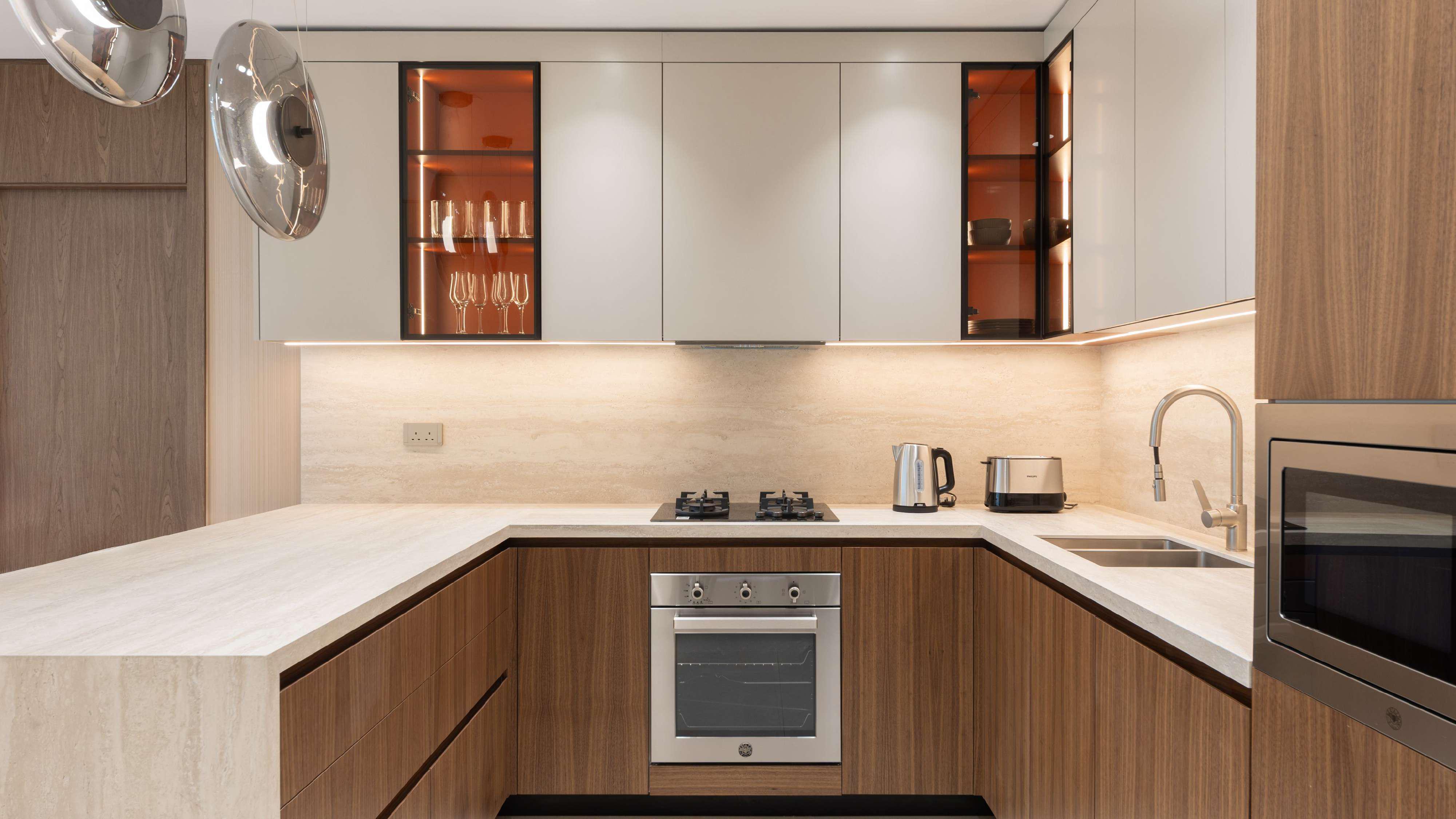 Kitchen and dining area in 3-bedroom apartment at A1LA Residence, Al Reem Island, Abu Dhabi, highlighting contemporary luxury living.