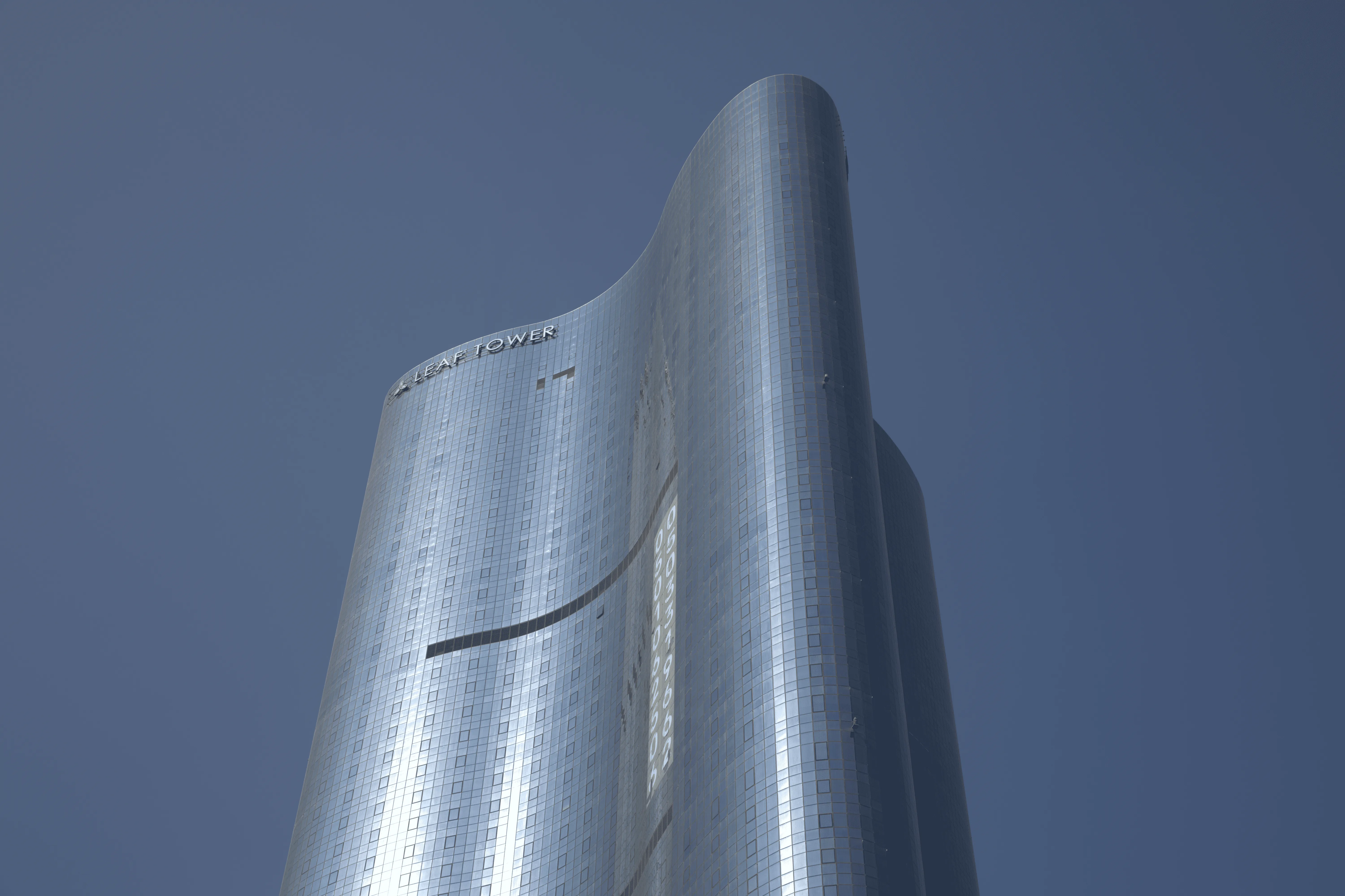Modern exterior view of Leaf Tower surrounded by the vibrant Al Reem Island community.