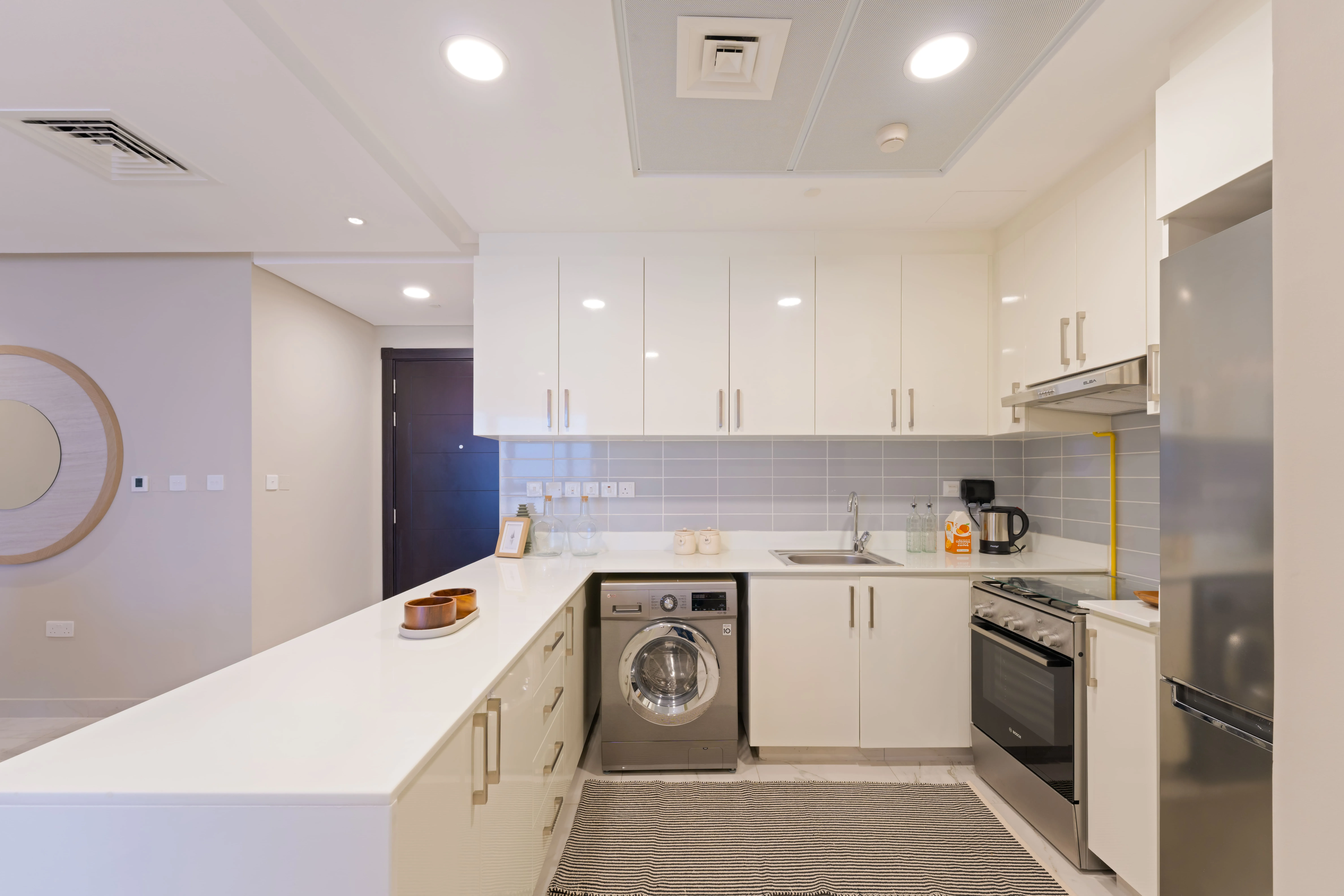 Contemporary kitchen at Leaf Tower featuring sleek cabinetry and quality finishes.