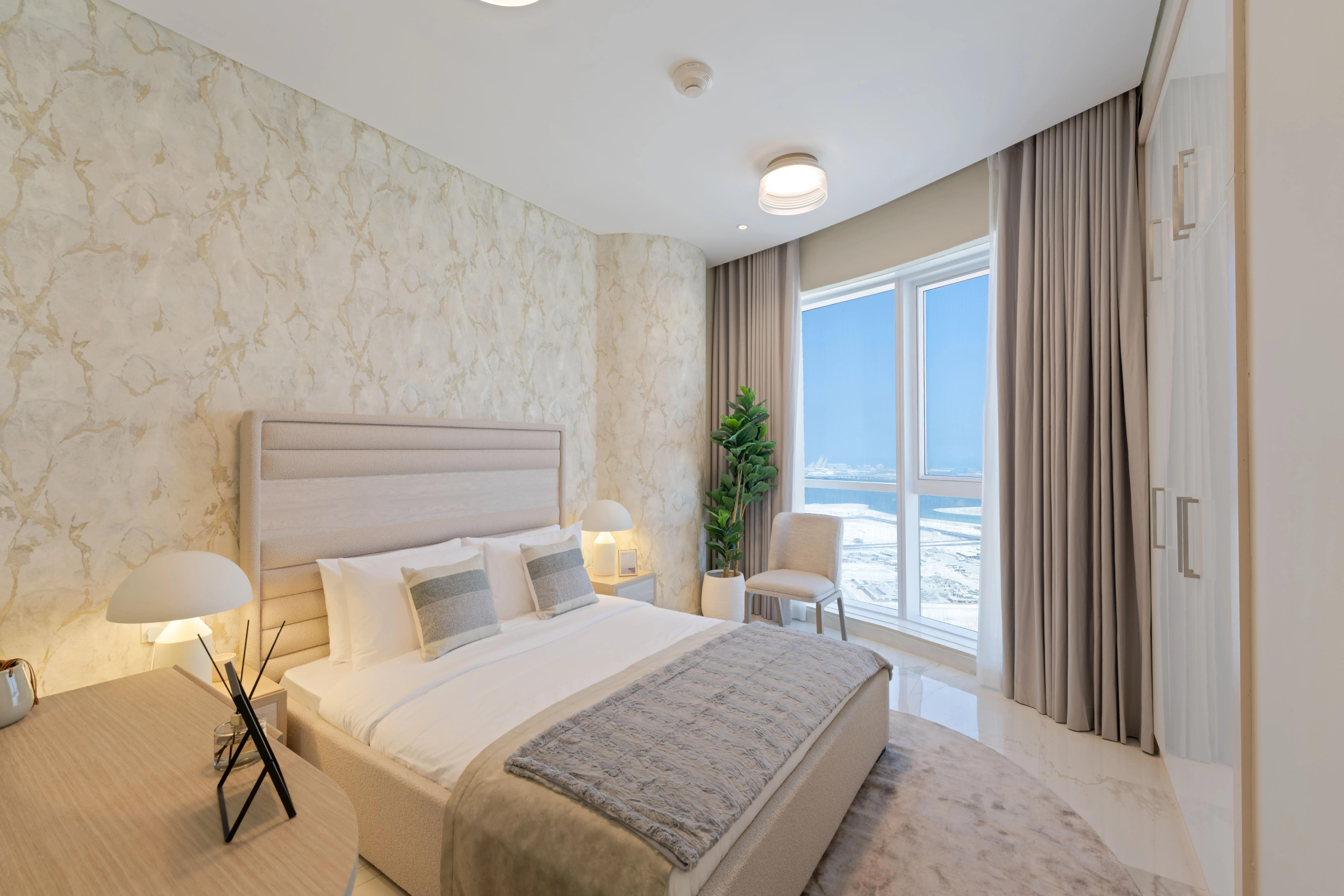 Spacious guest bedroom at Leaf Tower with comfortable contemporary design.