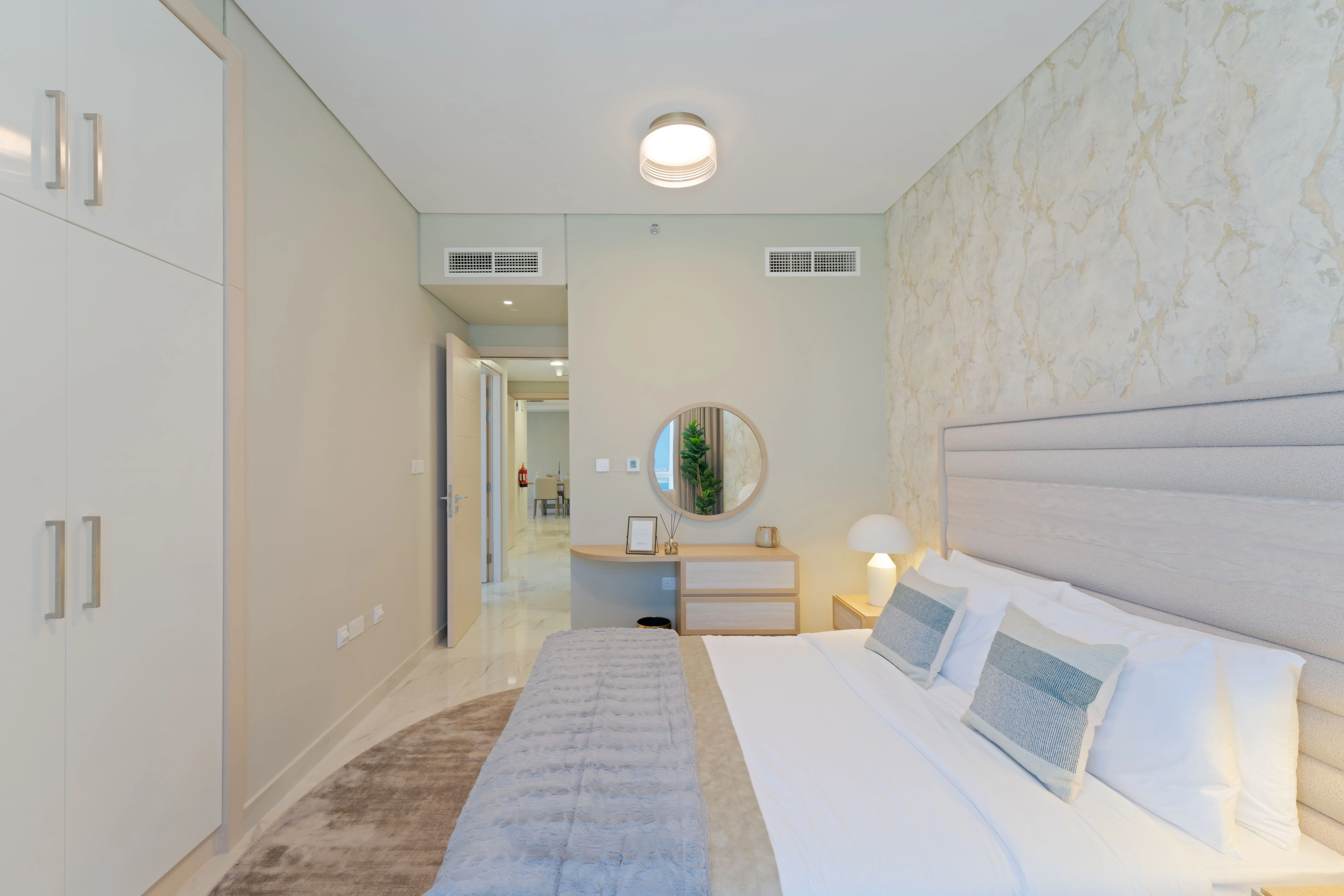 Contemporary master bedroom at Leaf Tower with premium interior finishes.