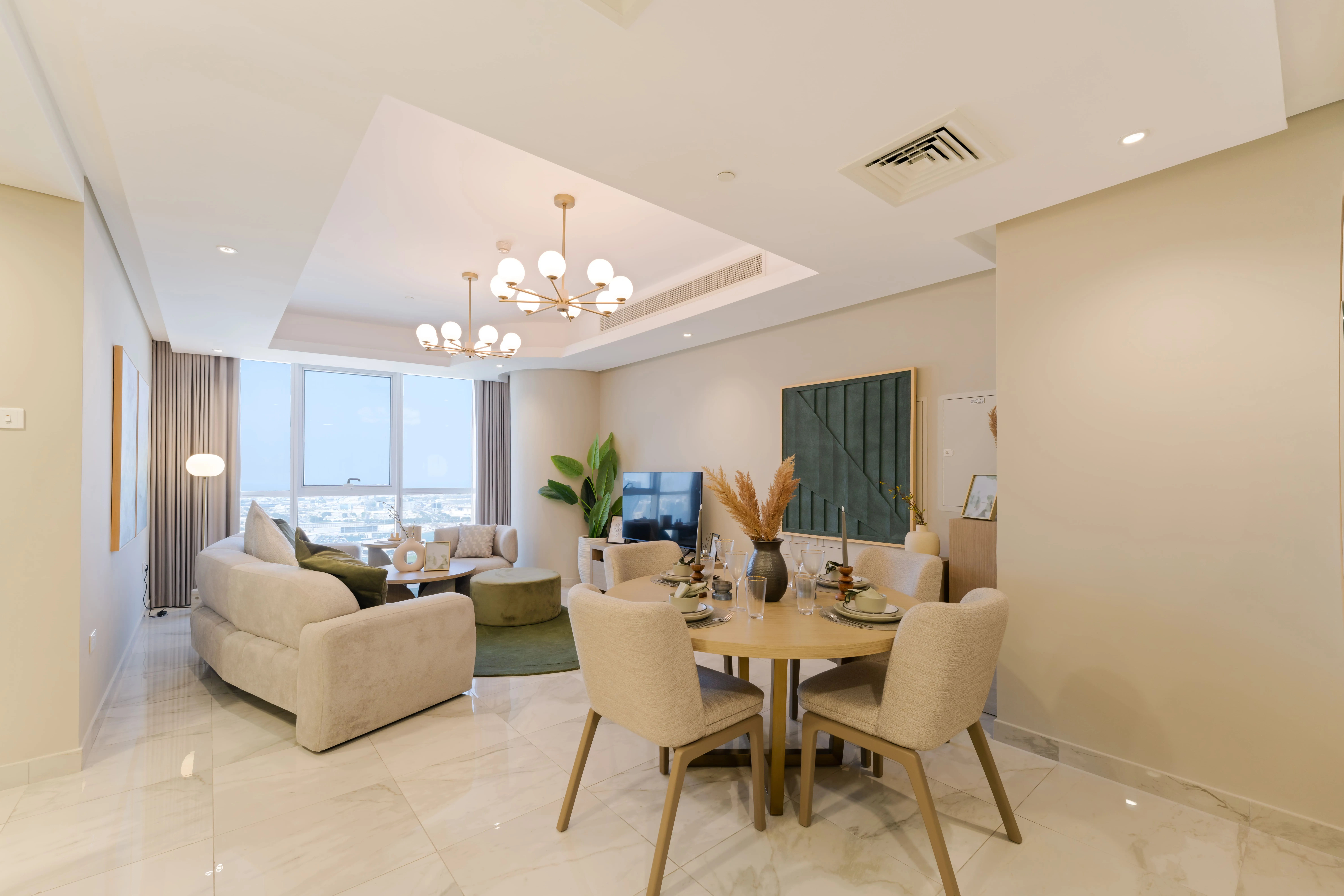 Open-plan living and dining space at Leaf Tower with contemporary residential interiors.