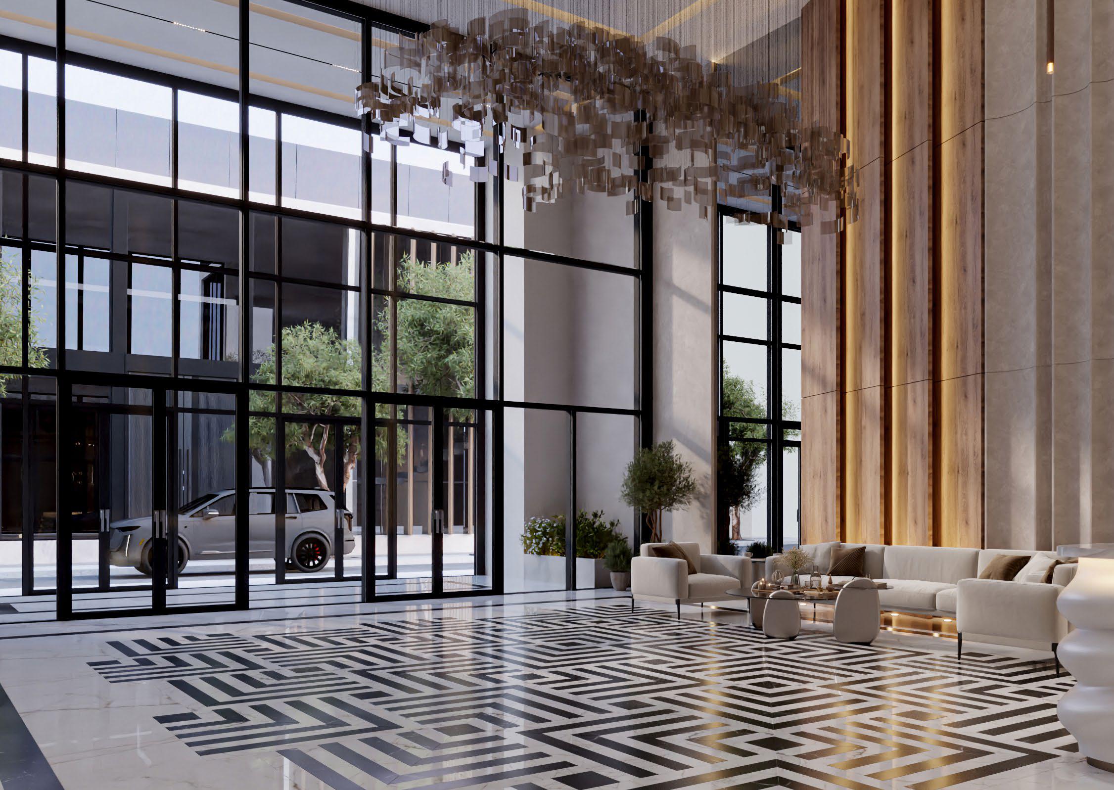Radiant Elite Tower living room interior featuring modern décor, soft lighting, and expansive windows framing panoramic sea and skyline views.