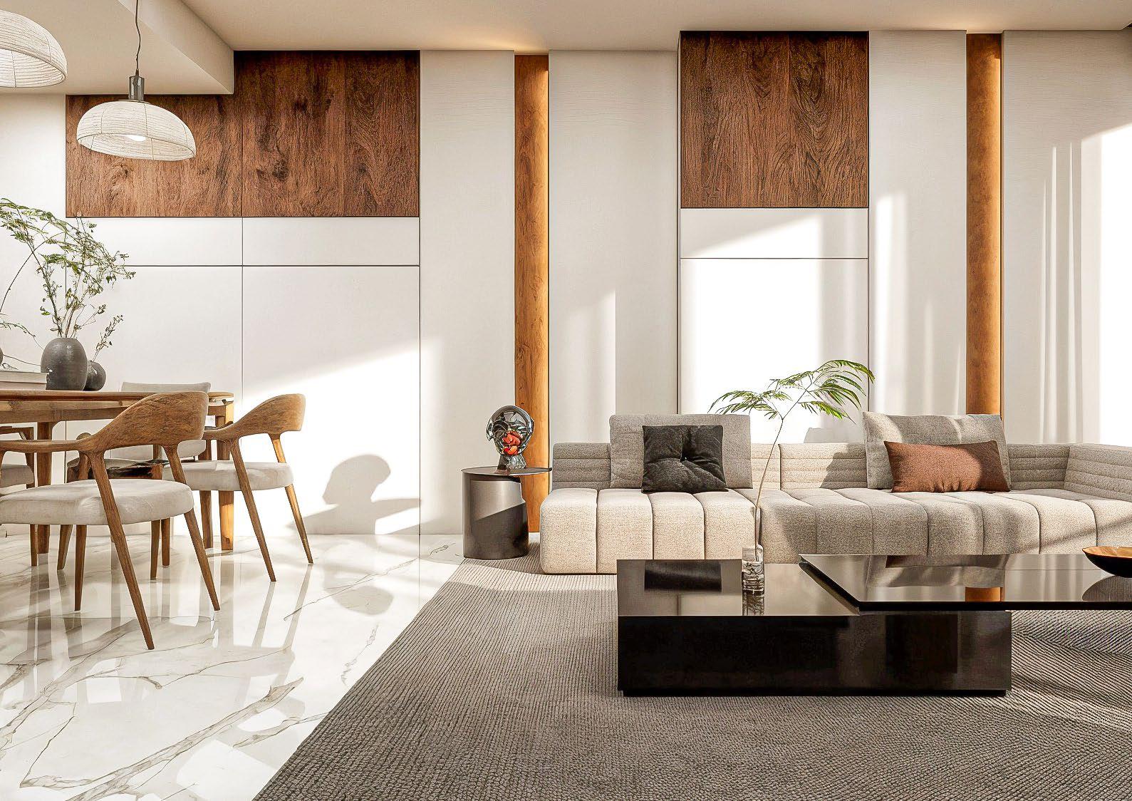 Radiant Elite Tower Sky Villa interior featuring double‑height ceilings, elegant staircase, and expansive glass panels with skyline views.