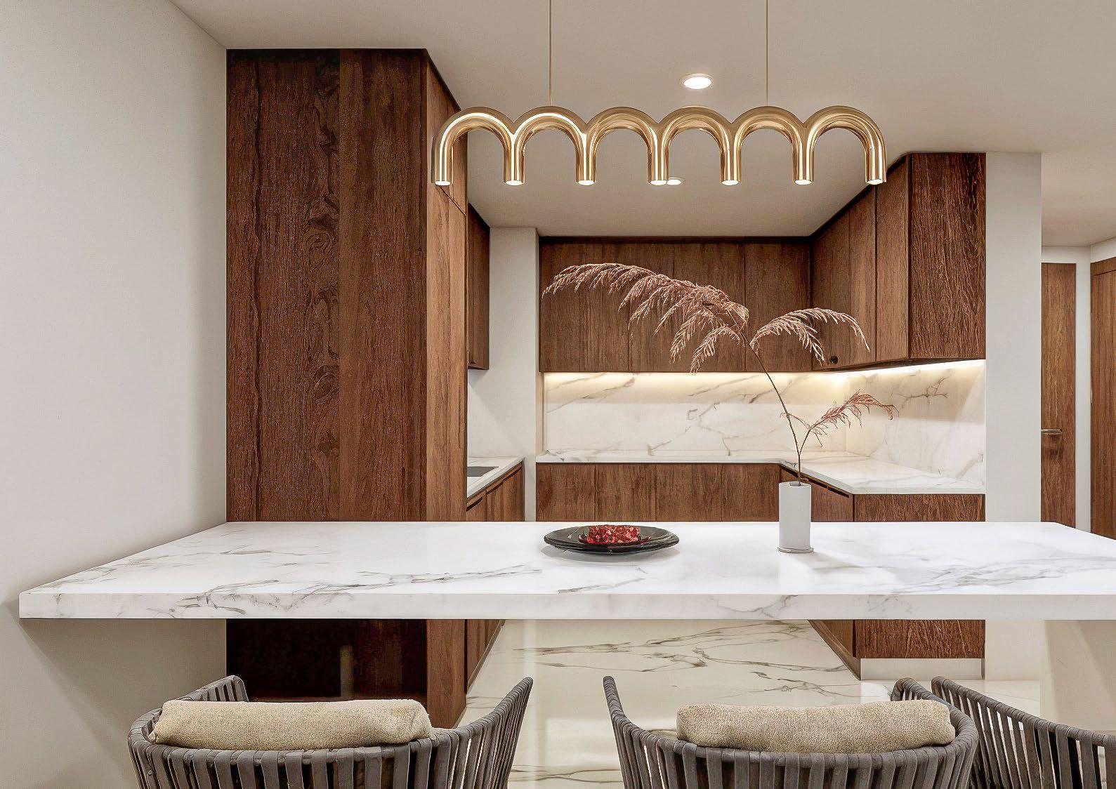 Dining area interior showcasing modern lighting and seamless living‑dining integration.