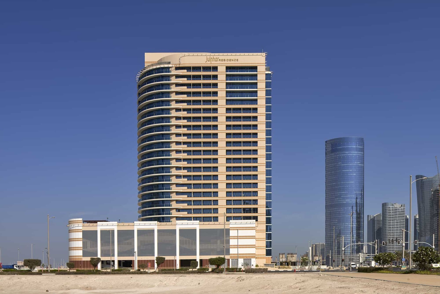 Julphar Residence exterior showcasing contemporary waterfront architecture on Al Reem Island, Abu Dhabi.