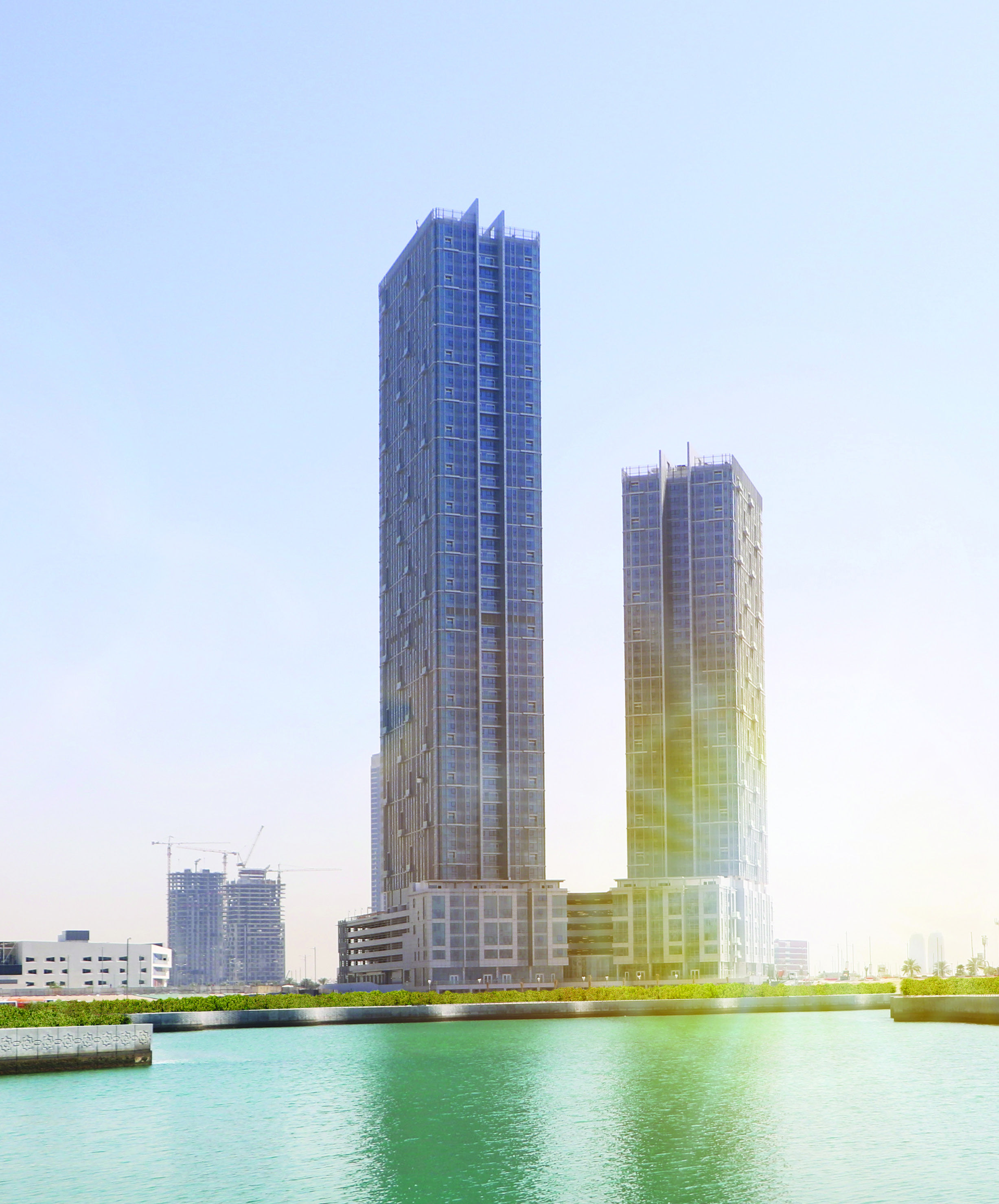 Twin residential towers of Horizon Towers overlooking the Abu Dhabi waterfront.