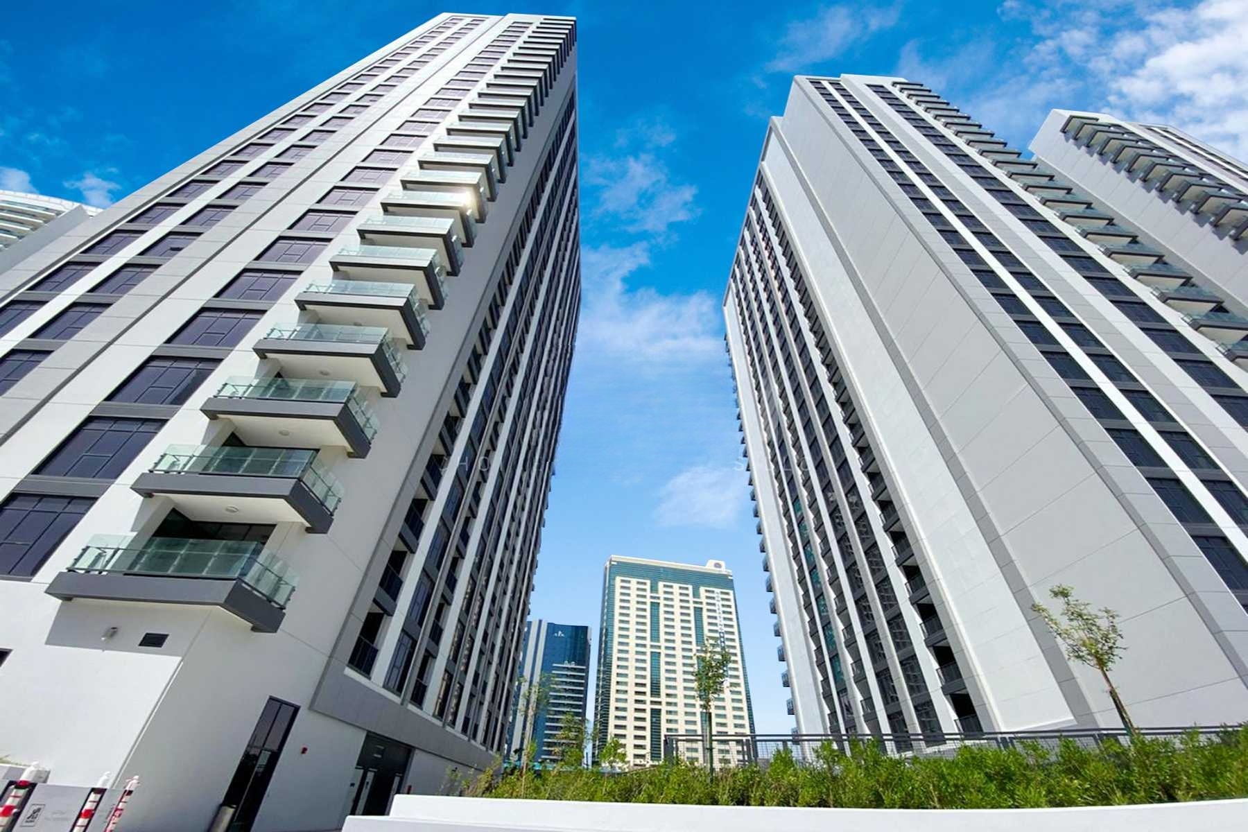 Exterior view of The Bridges towers on Reem Island Abu Dhabi showcasing luxury waterfront architecture and modern residential living.