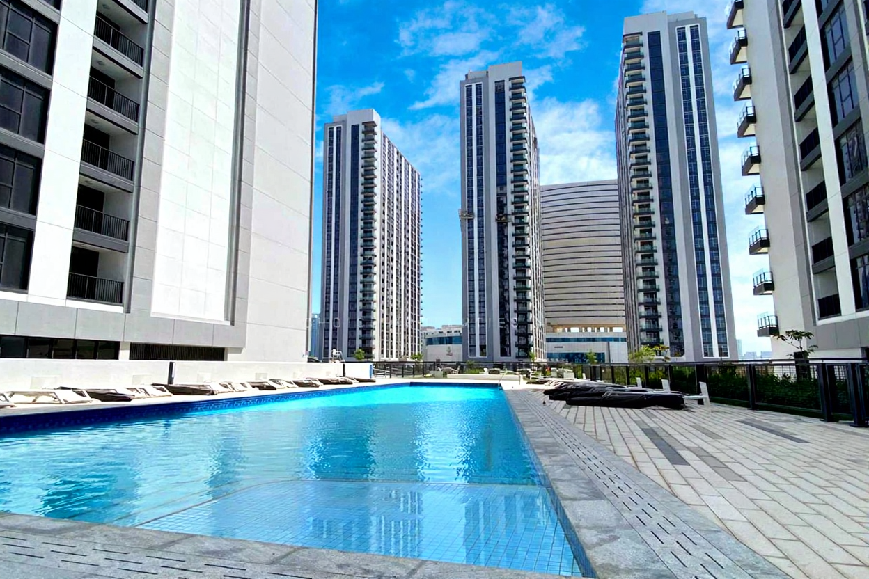 Aerial view of The Bridges six towers on Reem Island highlighting premium waterfront apartments and contemporary community design.