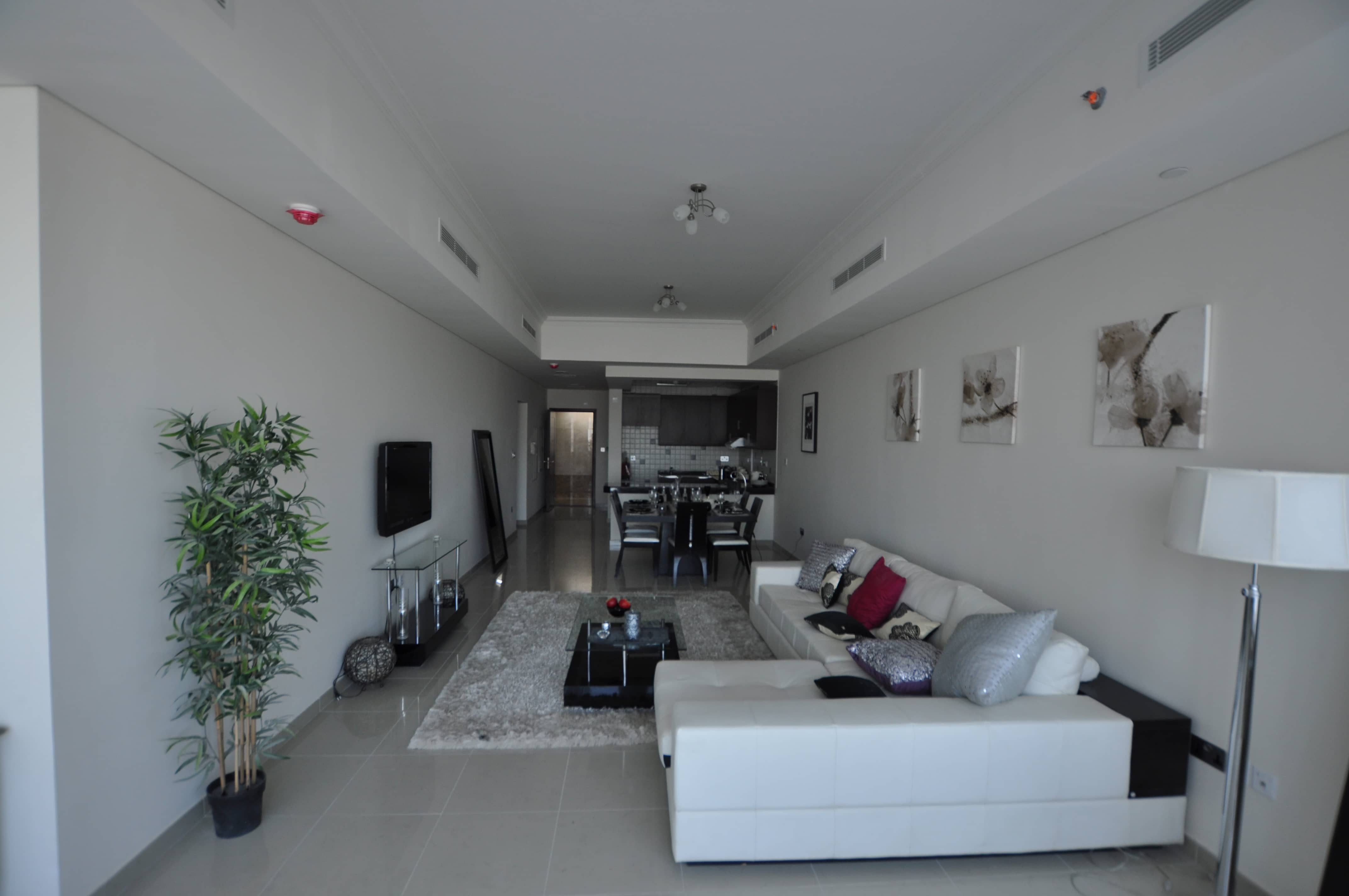 Bright master bedroom at Hydra Avenue Abu Dhabi apartment with spacious layout and modern interior finishes