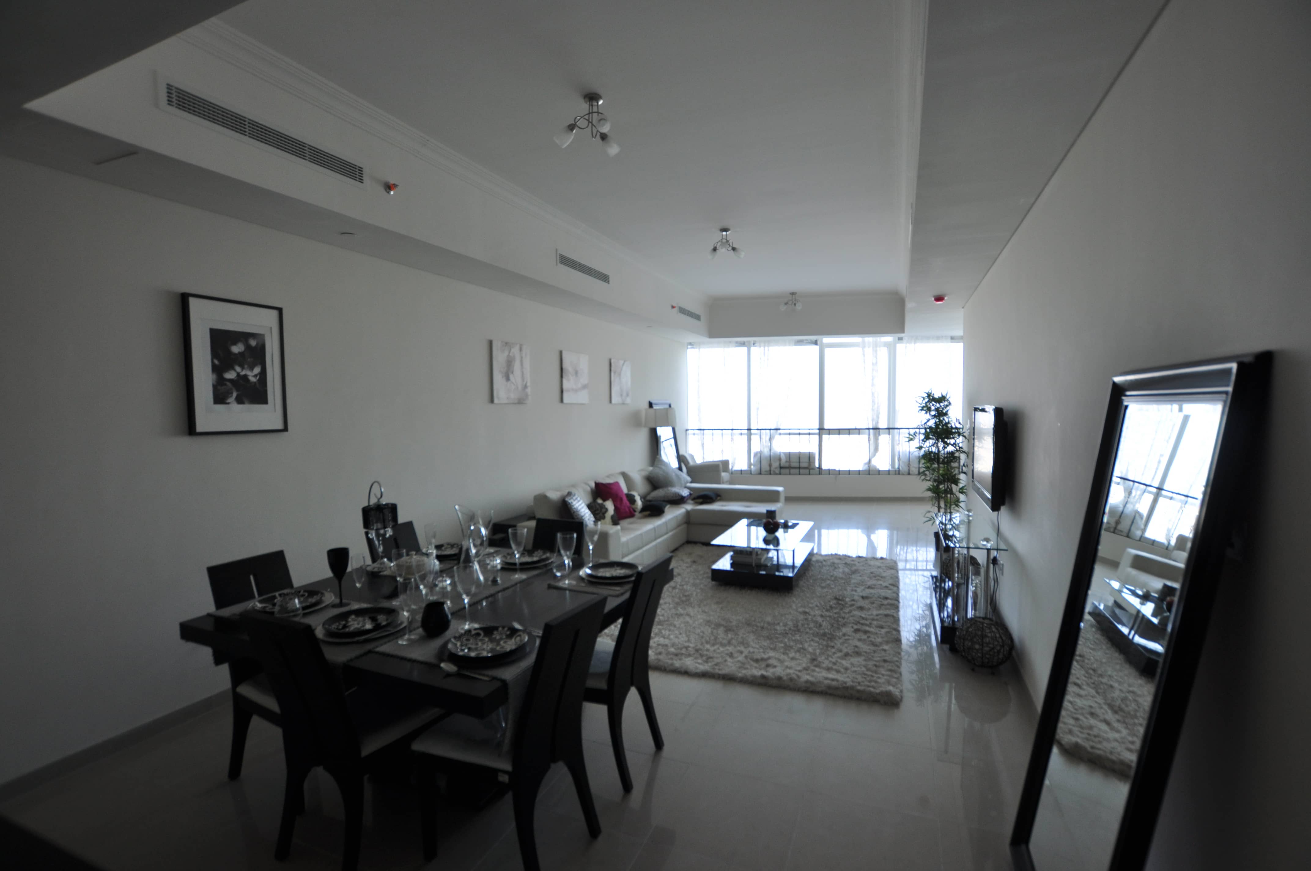 Modern living room at Hydra Avenue Al Reem Island apartment featuring contemporary interiors and elegant waterfront lifestyle