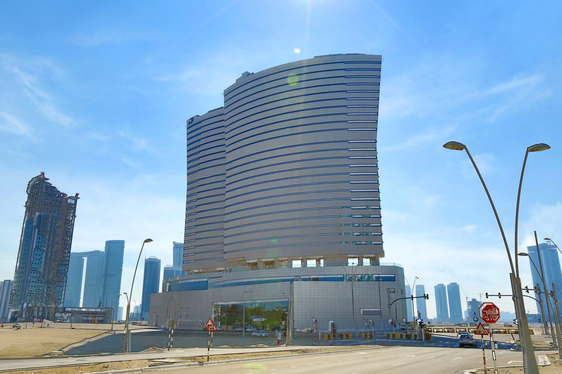 Oceanscape by Damac exterior facade rising above Al Reem Island, Abu Dhabi, featuring modern glass and aluminium waterfront architecture