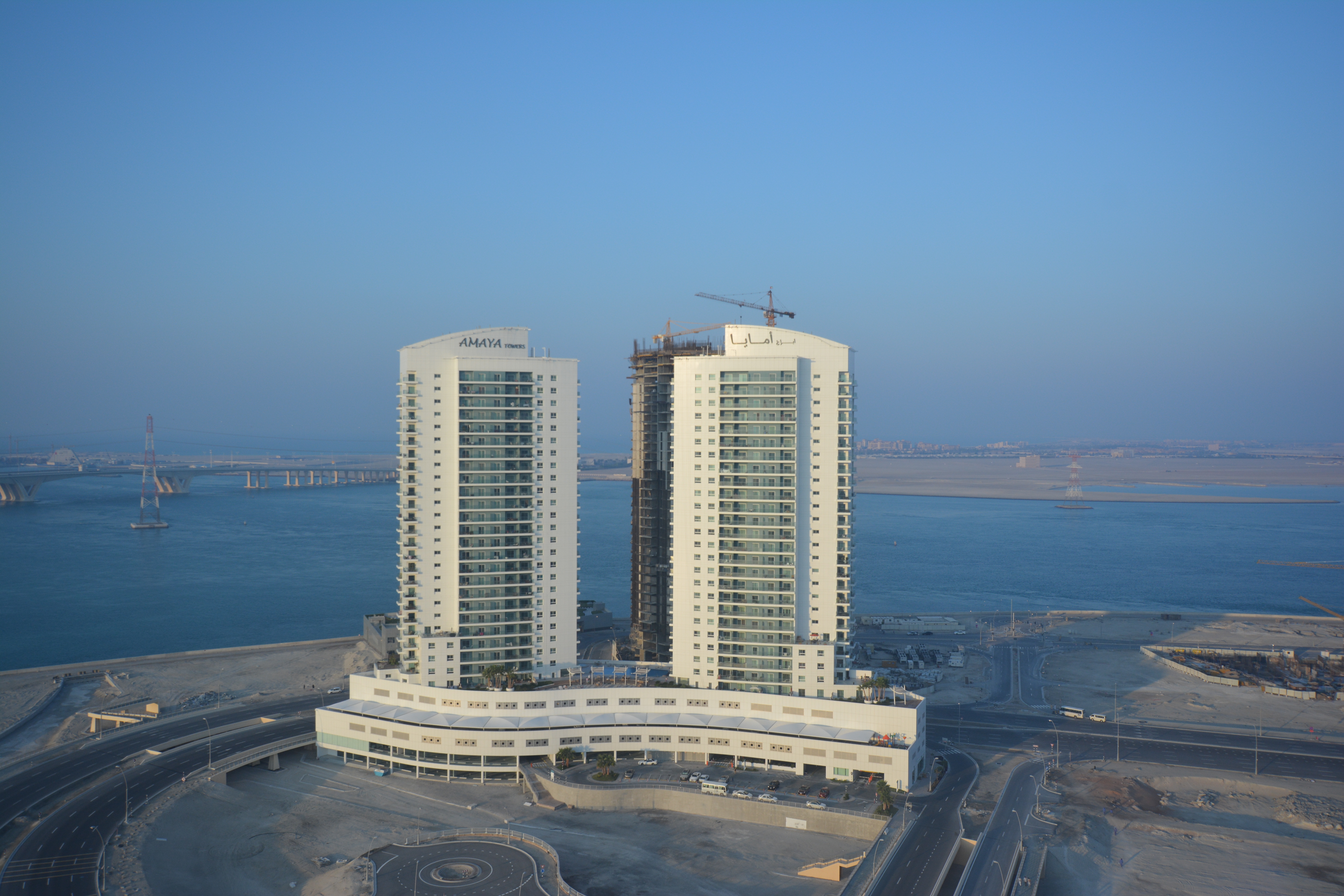 Waterfront exterior view of Amaya Towers in Shams Abu Dhabi, Al Reem Island showcasing modern residential high-rise buildings.