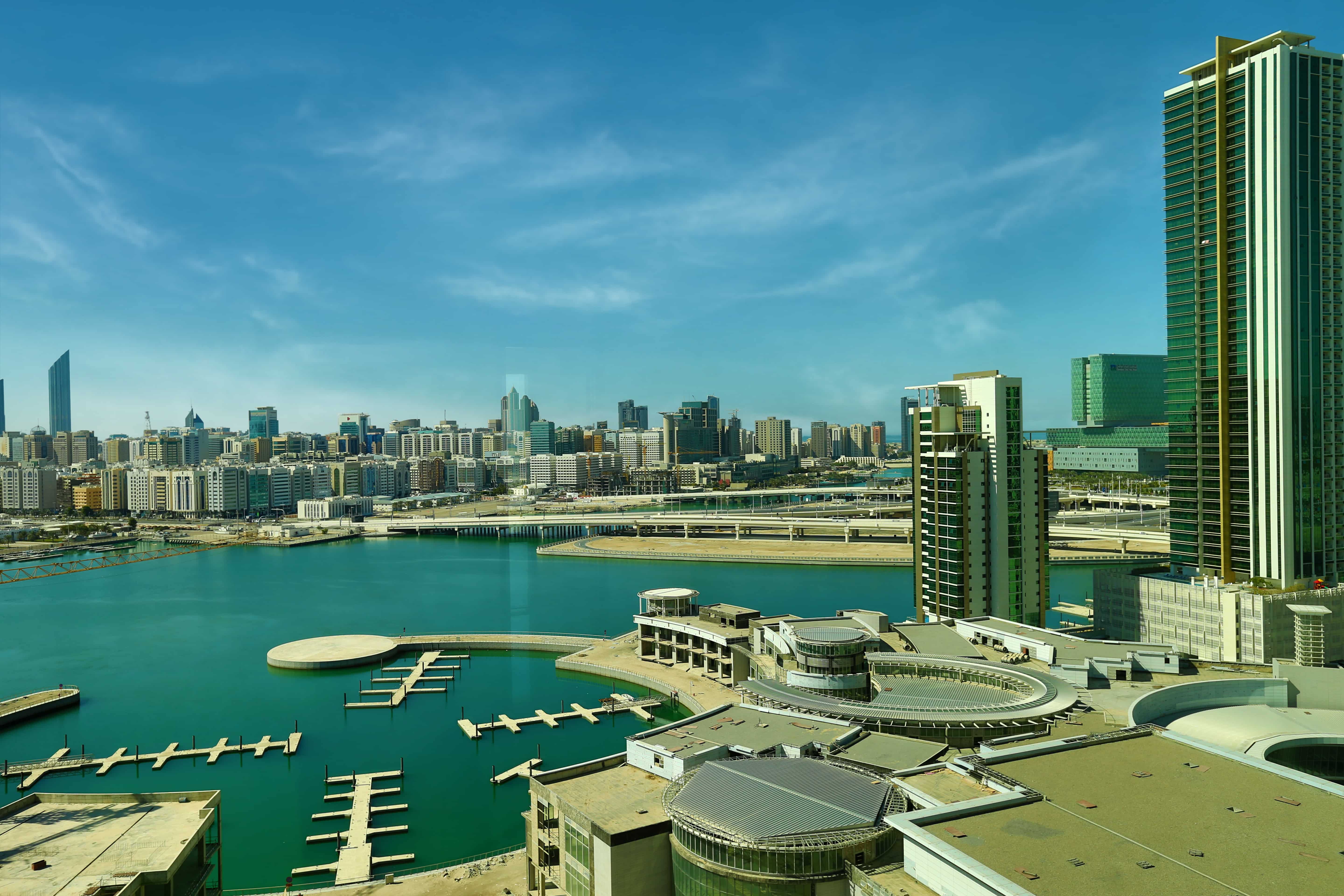 Panoramic exterior of Burooj Views Marina Square, Al Reem Island, Abu Dhabi highlighting elegant façade, balconies, and waterfront living.