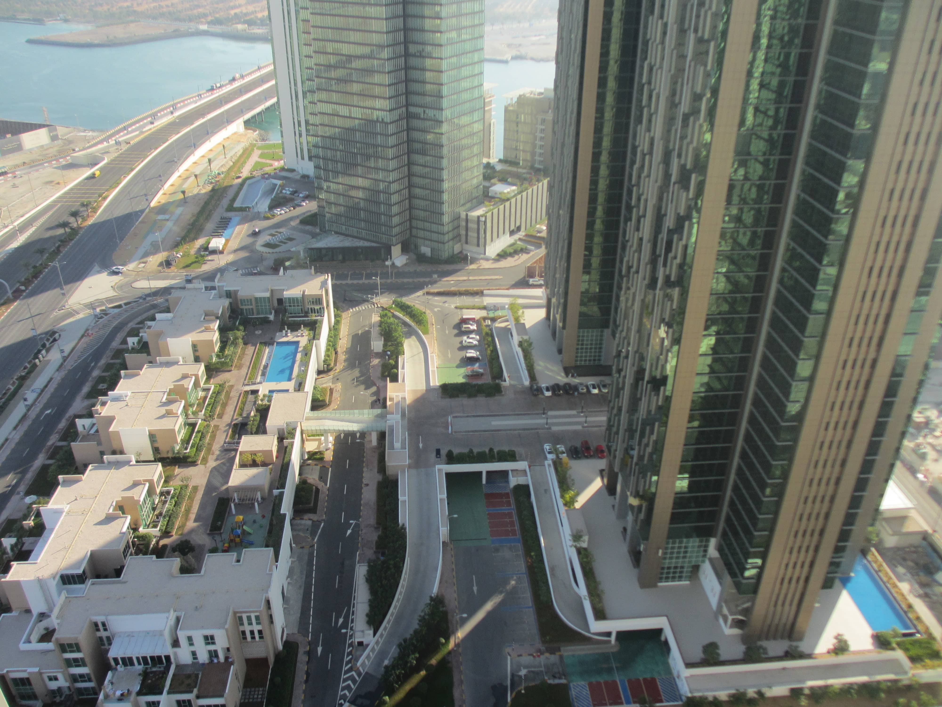 Waterfront perspective of Marina Blue Tower, Marina Square, Al Reem Island showcasing elegant high-rise apartments and scenic coastal views.